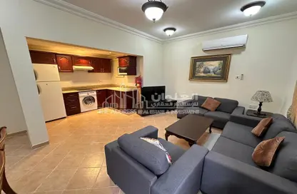 Living Room image for: Apartment - 1 Bedroom - 1 Bathroom for rent in Umm Al Seneem Street - Ain Khaled - Doha, Image 1