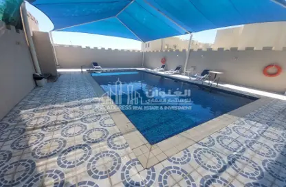 Pool image for: Villa - 4 Bedrooms - 4 Bathrooms for rent in Al Hanaa Street - Al Gharrafa - Doha, Image 1