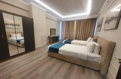 صورة لـ غرفة- غرفة النوم شقة - 3 غرف نوم - 3 حمامات للايجار في مشيرب - مشيرب - الدوحة ، صورة رقم 1