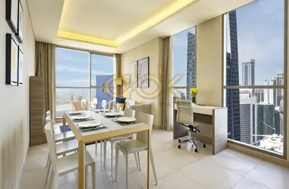 Living / Dining Room image for: Apartment - 2 Bedrooms - 2 Bathrooms for rent in West Bay Tower - West Bay - West Bay - Doha, Image 1