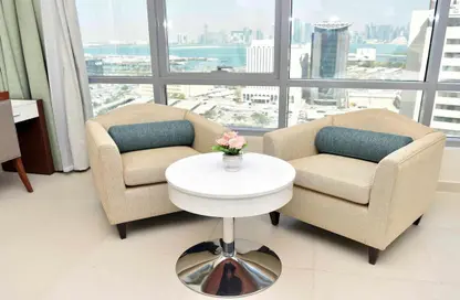 Living Room image for: Apartment - 1 Bathroom for rent in Musheireb Tower - Musheireb - Musheireb - Doha, Image 1
