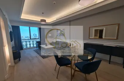 Living / Dining Room image for: Apartment - 1 Bedroom - 2 Bathrooms for sale in Bin Al Sheikh Towers - Al Mirqab Al Jadeed - Doha, Image 1