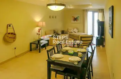 Living / Dining Room image for: Apartment - 1 Bedroom - 2 Bathrooms for sale in West Porto Drive - Porto Arabia - The Pearl Island - Doha, Image 1