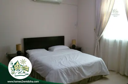 Room / Bedroom image for: Apartment - 1 Bedroom - 1 Bathroom for rent in Al Hanaa Street - Al Gharrafa - Doha, Image 1